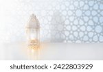 Small photo of Ramadan Kareem greeting. Islamic lantern near mosque with night sky with crescent moon and stars. End of fasting. Hari Raya card. Eid al-Fitr decoration. Breaking of holy fast day. Muslim holiday.