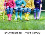 Group Of Kids In Rain Boots....