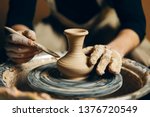 Man potter working on potters...