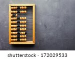 Accounting abacus on gray textured background with copy space