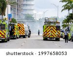 Small photo of Miami Beach Surfside, FL, USA - June 26, 2021: Scene near the Champlain Towers which collapsed trapping residents on June 24, 2021. National support and rescue efforts are in progress