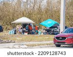 Small photo of Fort Myers, FL, USA - October 1, 2022: Free food and water being given out in Fort Myers after Hurricane Ian