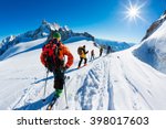 A Group Of Skiers Start The...