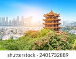 Small photo of Yellow crane tower against blue sky in wuhan, China, the four Chinese characters mean "As far as you can see in Hubei".
