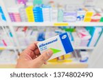 Small photo of Bangkok,Thailand-February 23,2019: Pharmacist holding Zithromax box from Pfizer and many medicines on shelf in pharmacy drugstore.Zithromax is used to treat many different kinds of bacterial infection