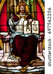 Small photo of NEW TRIER, MN - August 16, 2017: Stained glass window in Church of St. Mary, depicting Christ the King, the Alpha and Omega