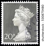 Small photo of UNITED KINGDOM - CIRCA 1970 to 1972: An English 20p Used Postage Stamp showing Portrait of Queen Elizabeth 2nd, circa 1970