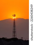 Small photo of Telephone tower, radio tower during sunset. Telecommunication Tower for 2G 3G 4G 5G network, Cellular phone antenna, BTS, microwave, repeater, base station, IOT.telecommunication tower on golden sky