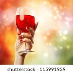 Woman Holding A Wine Glass On...