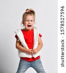 Small photo of Crying, yelling loud, abused helpless kid girl in red t-shirt after family conflict. Got lost. Defenceless. In difficulty. Family conflict, violence, injustice, unfairness