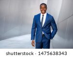 Small photo of Stylish chic modern style business suit executive, african american male commercial model, walking to swanky office workplace