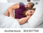 Small photo of Unsatisfied couple problems troubles in bedroom lying in bed insomniac husband wife