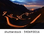 Traffic trails on Transfagarasan pass at night. Crossing Carpathian mountains in Romania, Transfagarasan is one of the most spectacular mountain roads in the world
