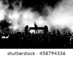 DJ Musician Band in Black and White Silhouette and Crowd at a Music Festival Concert - Backlit. 