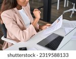 Small photo of Close up view of female HR manager reading cv during virtual remote online job interview concept. Business woman employer holding resume hiring recruit in professional recruitment agency.