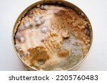 Small photo of multi-colored mold on canned food. violation of storage conditions. spoiled products. poisoning and eating disorders. danger to life. on a white background.