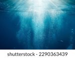 Sunlight underwater with bubbles rising to water surface in the sea, Mediterranean, France