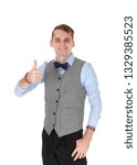 Small photo of An image of a young happy businessman smiling and showing his thump up agreeing with the dissension, isolated for white background