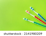 multicolored toothbrushes on a... | Shutterstock . vector #2141980209