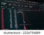 Global fall of cryptocurrency graph - FTT token fell down on the chart crypto exchanges on app screen. FTX exchange bankruptcy and the collapse depreciation of token