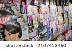 Small photo of LONDON, UNITED KINGDOM- 28 OCTOBER 2015: Magazine rack with many British titles such as Grazia, Hello, Look, Now, TV Choice and Heat featuring gossip, scandals, soap stars, royalty and showbiz news.