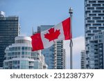 Canadian flag with downtown...