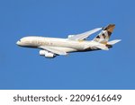 Small photo of London Heathrow, United Kingdom - August 28, 2015: An Etihad Airways Airbus A380 with the registration A6-APC taking off from London Heathrow Airport (LHR) in the United Kingdom.