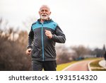 Active senior man is jogging....