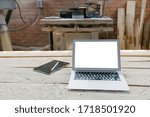 Open Laptop In A Woodshop With...