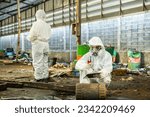 Small photo of Male inspector team investigate danger chemical gas leak spill with safety face mask PPE suit in area closed barricade security tape. danger dirty area infected chemical leak spill cross stripe ribbon