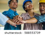 Small photo of employee group from asian factory make hand shake. manager and worker meeting to good factory performance. the worker is importance for factory.the factory unshaken because employee have good relation
