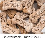 Close-up view of home made dog treats with the word Woof