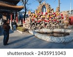 Small photo of Beijing, China - March 28, 2013: Shrine in front of Catholic Church of the Saviour also called Xishiku Church or Beitang in Beijing