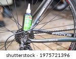 Small photo of Norwich, Norfolk, UK - May 15 2021. Close and selective focus on a bottle of TF2 all weather lubricant used to service and maintain a racing bicycle.