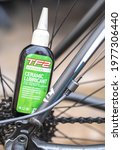 Small photo of Norwich, Norfolk, UK - May 15 2021. Close and selective focus on a bottle of TF2 all weather lubricant used to service and maintain a racing bicycle.