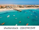 Small photo of Pier and boats on turquoise water in city of Santa Maria, Sal, Cape Verde