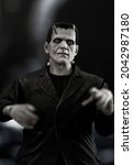 Small photo of SEPT 15, 2021: Frankenstein monster lurking in a castle dungeon - NECA Ultimate black and white figure