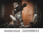 Small photo of NOV 9 2022: scene from Star Wars the Clone Wars, clone trooper with blaster fighting battle droids - Hasbro action figures