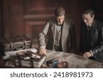 Small photo of JAN 29 2024: Indiana Jones and Marcus Brody studying a map in a library - Hasbro action figures