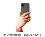 Person holding in hand mobile phone with triple lens camera, photo isolated on white background