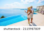 Small photo of Wealthy couple enjoying beautiful sea view of luxury Mediterranean villa