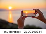 Woman Holding Mobile Phone In...