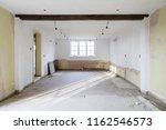 Small photo of Empty room in an old house undergoing refurbishment, remodeling and redecoration, in preparation for a kitchen refit
