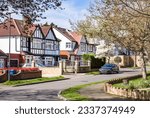 Small photo of Tudor-style semi-detached houses on a suburban street in Hatch End, Harrow, London, UK