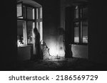 Small photo of Ghosts in abandoned, haunted house. Horror scene of scary spirits, halloween concept.