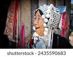 Small photo of CHIANG MAI THAILAND- FEBRUARY, 2019 : Hill tribe woman selling her goods in Baan Tong Luang eco village near Chiangmai,Thailand