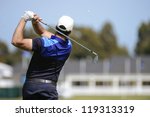 Golfer Hits An Fairway Shot...