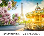 Small photo of Eiffel Tower with merry go round from Trocadero at spring sunrise, Paris, France