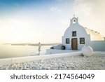 Small photo of beautiful details of Santorini island - typical house with white walls and blue Aegan sea water, Santorini Greece, toned