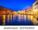 view of famouse Rialto bridge illuminated at night, Venice, Italy, toned